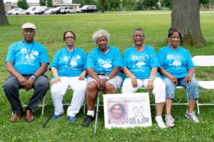 William Donaldson, Evie Mitchell, Dorothy King, Etta Ruth Rials, and Elnora Sled with picture of parents, Barbara and Sam Donaldson.