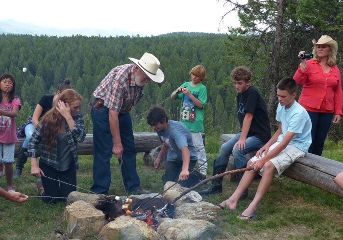 McClellan family roasting marshmallows at Bar W Ranch.