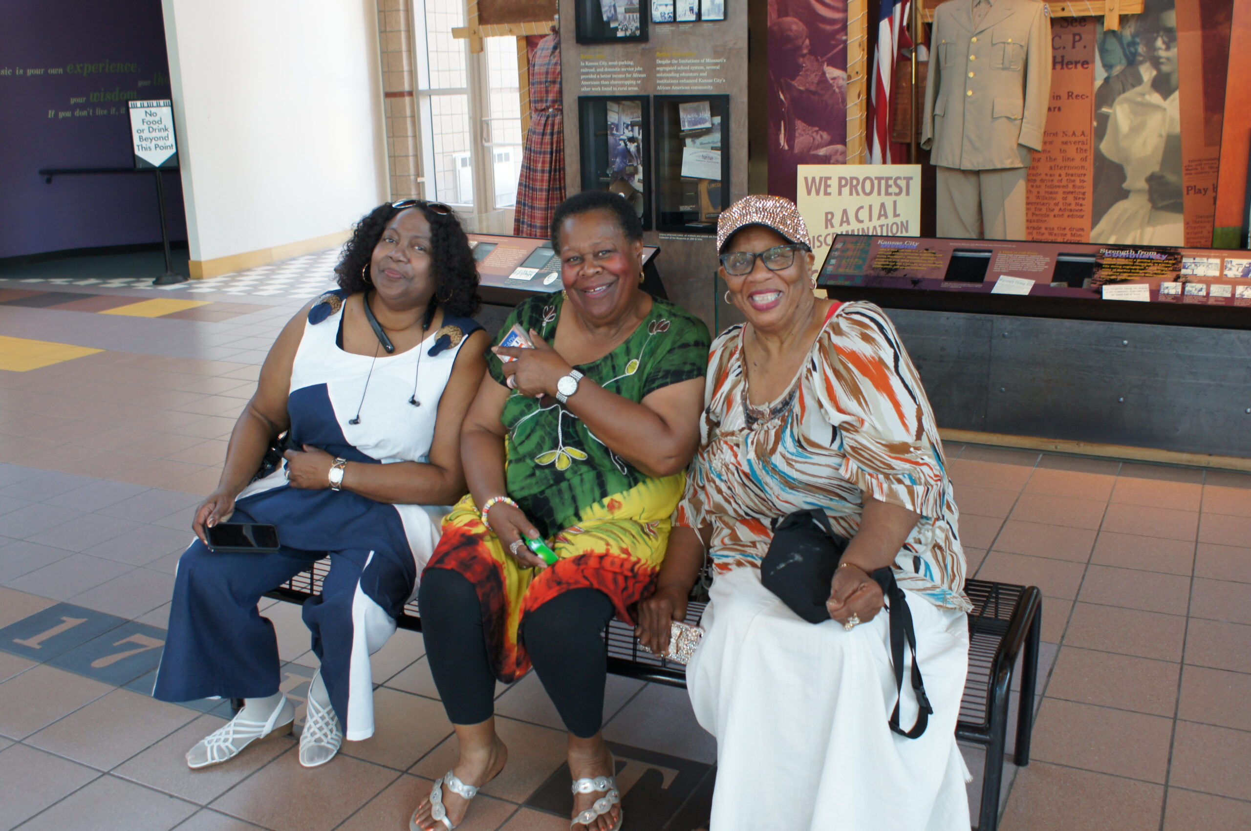 Juanita Lewis, Jessie Lee Brown and Doris Manning seated in lobby of Negro League Baseball and Jazz Museums in Kansas City, Missouri.