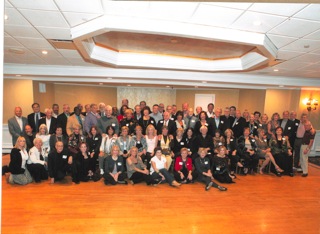 Author Karen Setlowe, center in yellow vest, with her Lawrence High School, Class of 1961 50th reunion on Long Island, New York. Photo courtesy of Larry Hacken, Absolute Elegance.