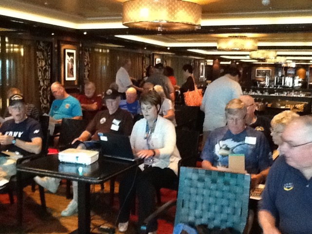Seminar@Sea planners preparing for a meeting. Norwegian Cruise Line Group Marketing Director, Roz Young, in the white sweater.