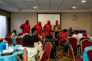 Donald and Devin Stuckey and Patrick and Lisa Sled doing karaoke version of Gladys Knight and the Pips song "Midnight Train to Georgia" at meet and greet.