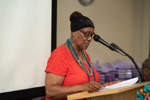 Minister Elnora Sled at the meet and greet presenting welcome address and opening prayer.