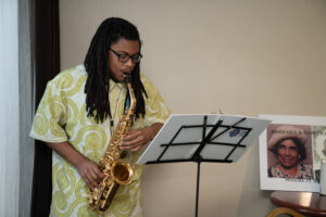 Saxophonist, Tyberius Livingston, entertaining at the for meet and greet.