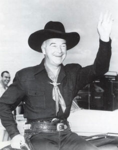 Hopalong Cassidy waving to admirers. 