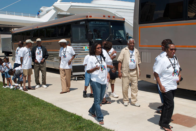 When the McNair-Brazil-Scott Family Reunion tours, they do so in chartered buses. Here they're arriving for a visit at the Milwaukee Art Museum on Lake Michigan.