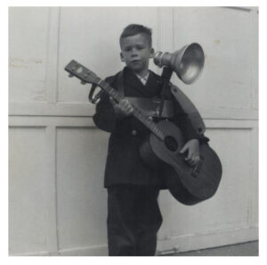 Joel Samberg at age eight performing at a family circle meeting. 